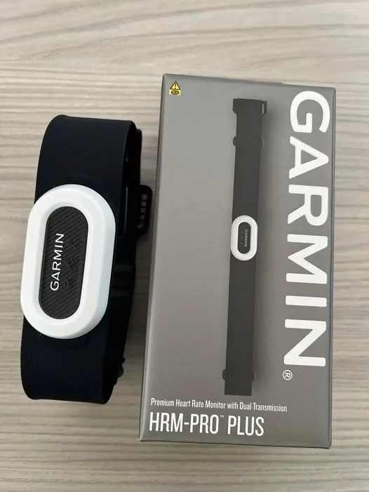 garmin-hrm-pro-plus-box-and-strap-526w Garmin HRM-PRO Plus chest strap heart rate monitor next to the retail box.